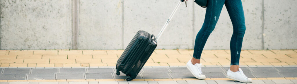 3 Best Hardside Carry-On Luggage Cases - woman with carry on