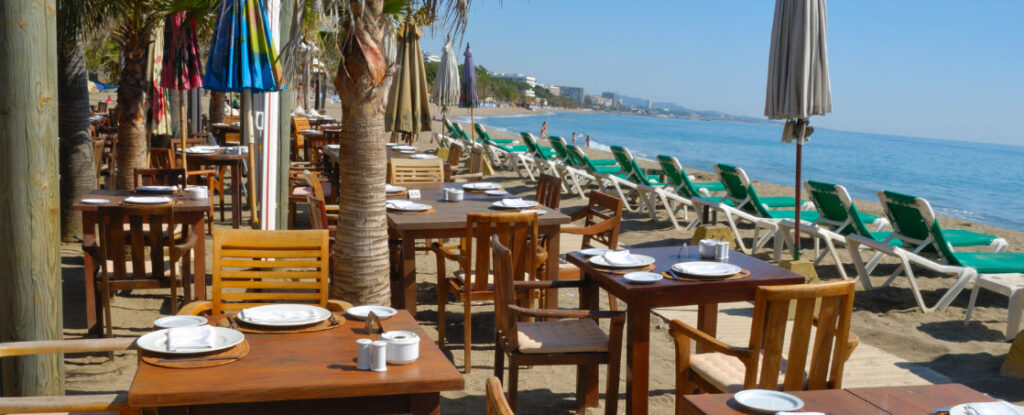 Tips for better sleep when traveling - restaurant on beach