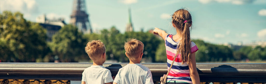 Family travel tips - kids looking at Eiffel tower