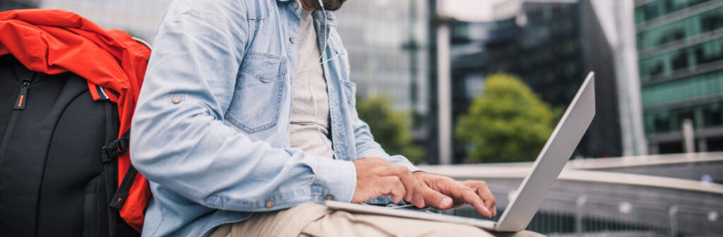 laptop backpacks - traveler using laptop