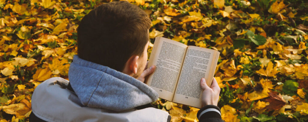 Tips for traveling alone - boy reading book