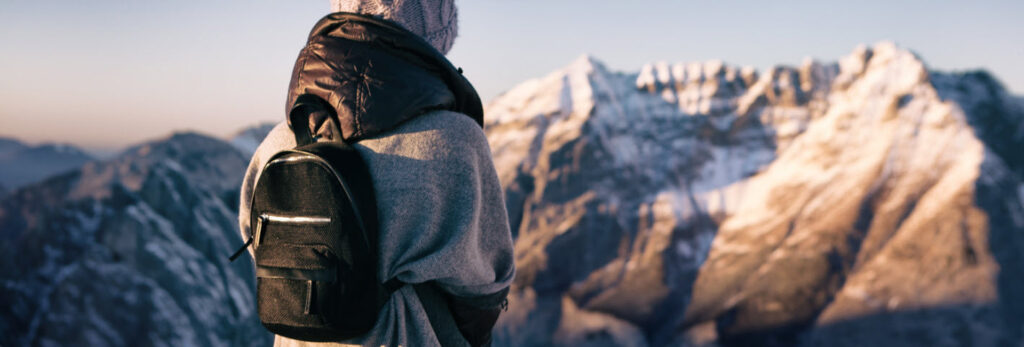 travel backpacks - girl with backpack. in snow