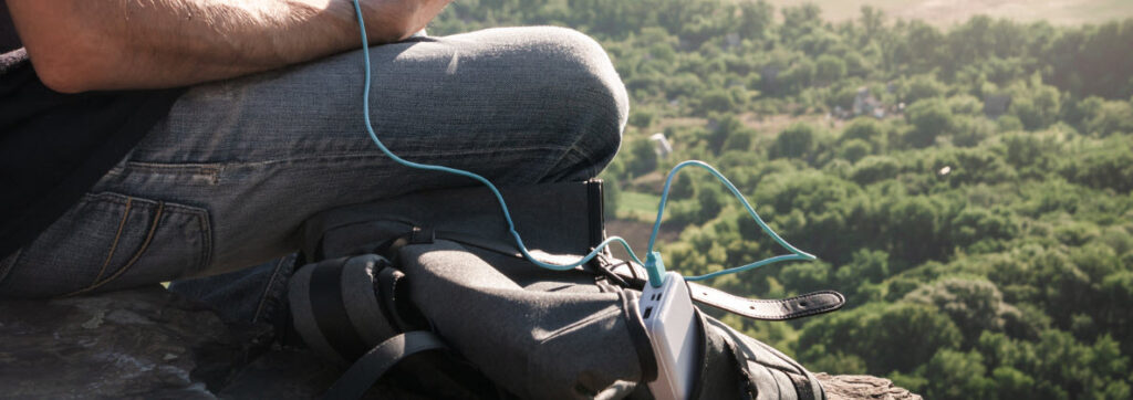 Power Banks for Travel - man with power bank in backpack