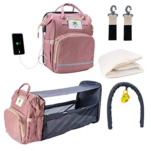 5-in-1 (Upgraded) Travel Bassinet Foldable Baby Bed, Portable Diaper Backpack Bag with Changing Station, Waterproof, USB Charging Port, Sun Shade, New Toy Bar and Toy + More (Pink)