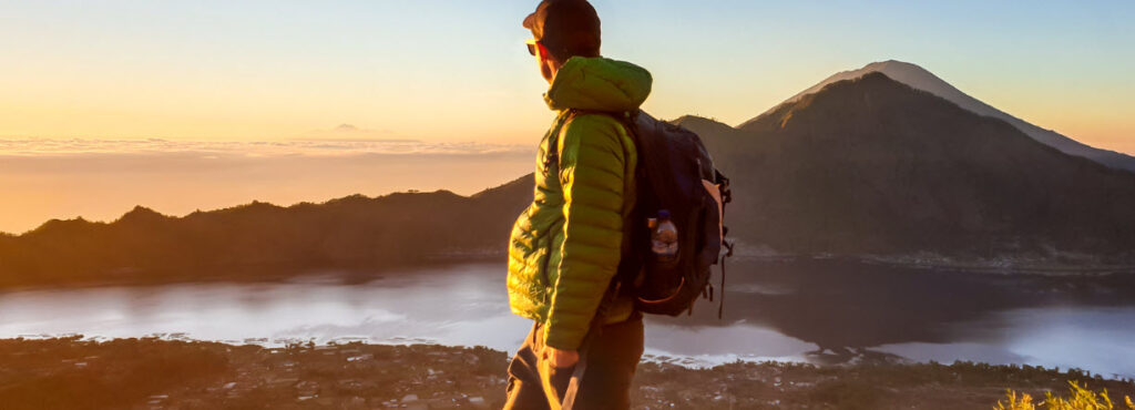 Best hiking trails in bali - man at Mt bakur at sunrise