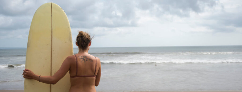 Getting a Tattoo in Bali - girl on Bali beach with Tattoo