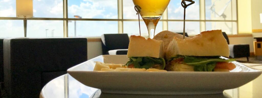 Tips For Saving Money At The Airport - sandwich in lounge