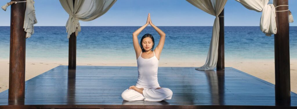 Luxury resorts in Bali - Yoga beside beach