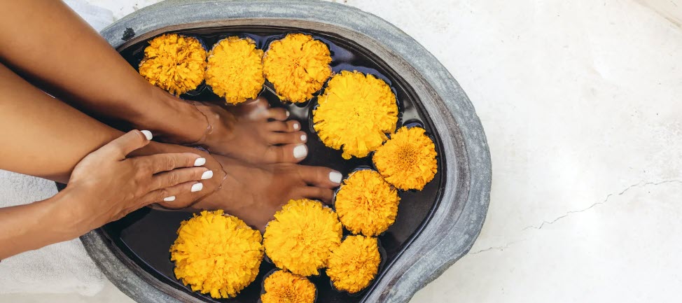 best spas in Bali - Feet in flower bowl