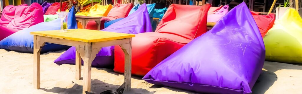 seminyak vs canggu - beanbags on beach