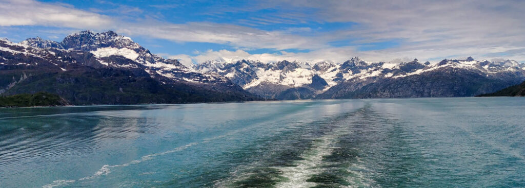 Best Alaskan Cruises from Seattle - Alsakan mountains behind ship