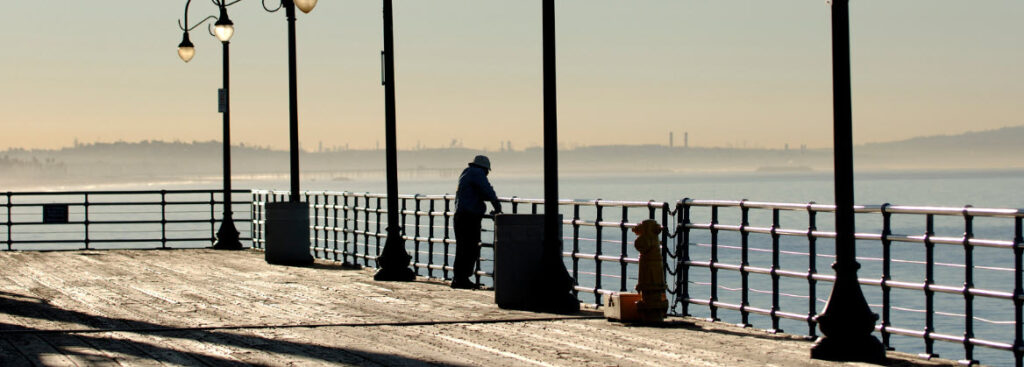 Best Fishing Spots in California - Man fishing on Santa Monica Pier