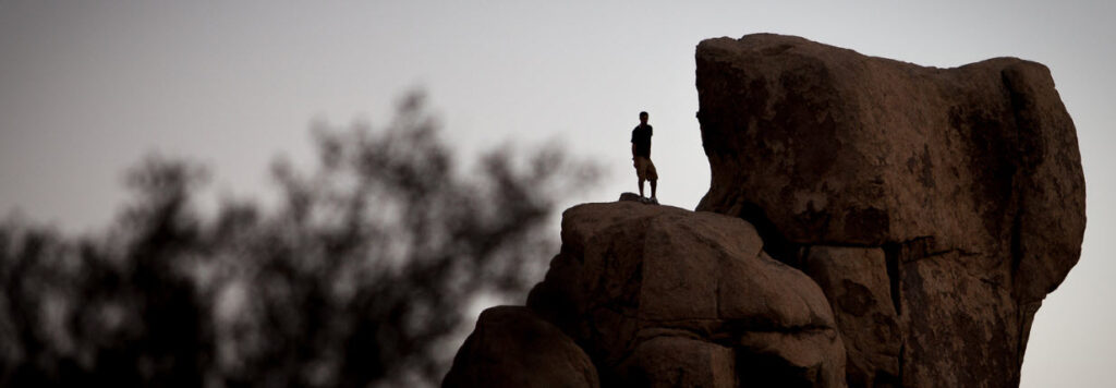 Best Rock Climbing Spots In Southern California - Man on rock at Joshua Tree