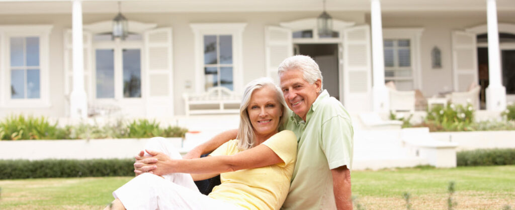 What Is Housesitting - elderly couple in front of house