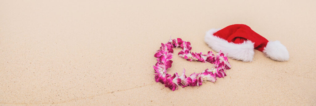 best things to do in Hawaii at Christmas - Christmas hat on beach