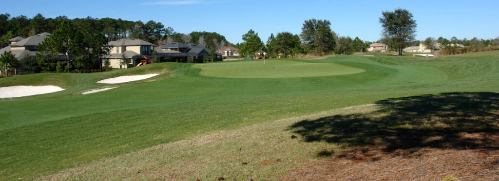 Best Golf Courses on the Florida Historic Golf Trail - Green near houses