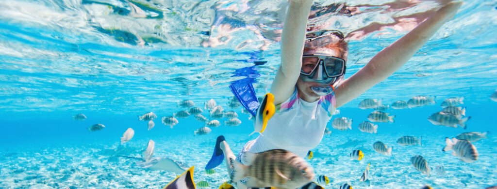 best travel snorkel sets - girl snorkeling